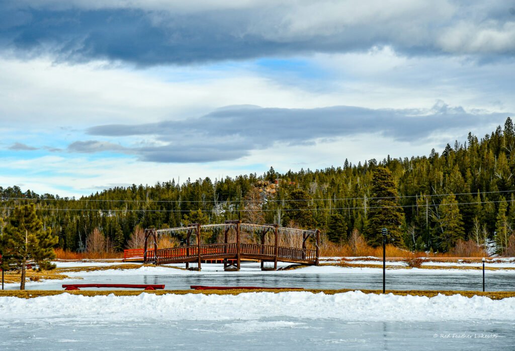 Arbored Bridge at Entrance to Beaver Meadows Resort in Winter, Red Feather Lakes, Colorado