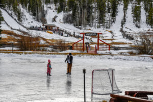 Red Feather Lakes.US-97 Outdoor ice skating at snow-covered park