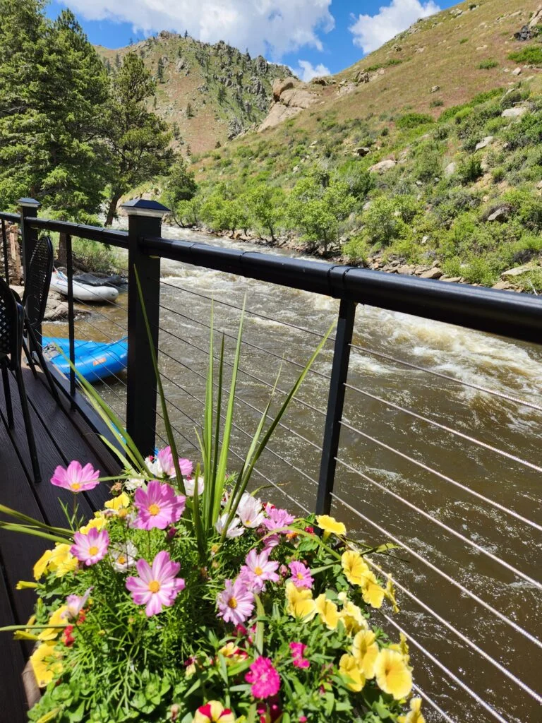 Deck overlooking the Poudre River at The Mishawaka on Hwy 14 Poudre Canyon Scenic Byway near Livermore & Red Feather Lakes, Colorado
