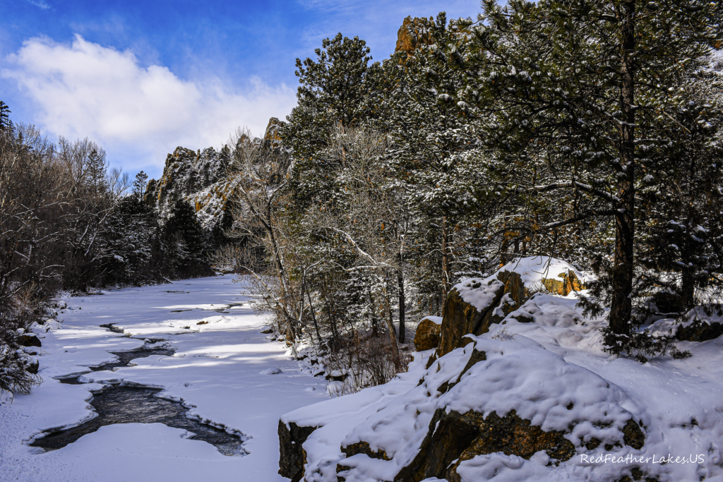 Rock Outcroppings with Dappled Sunshine set against the Cache La Poudre River