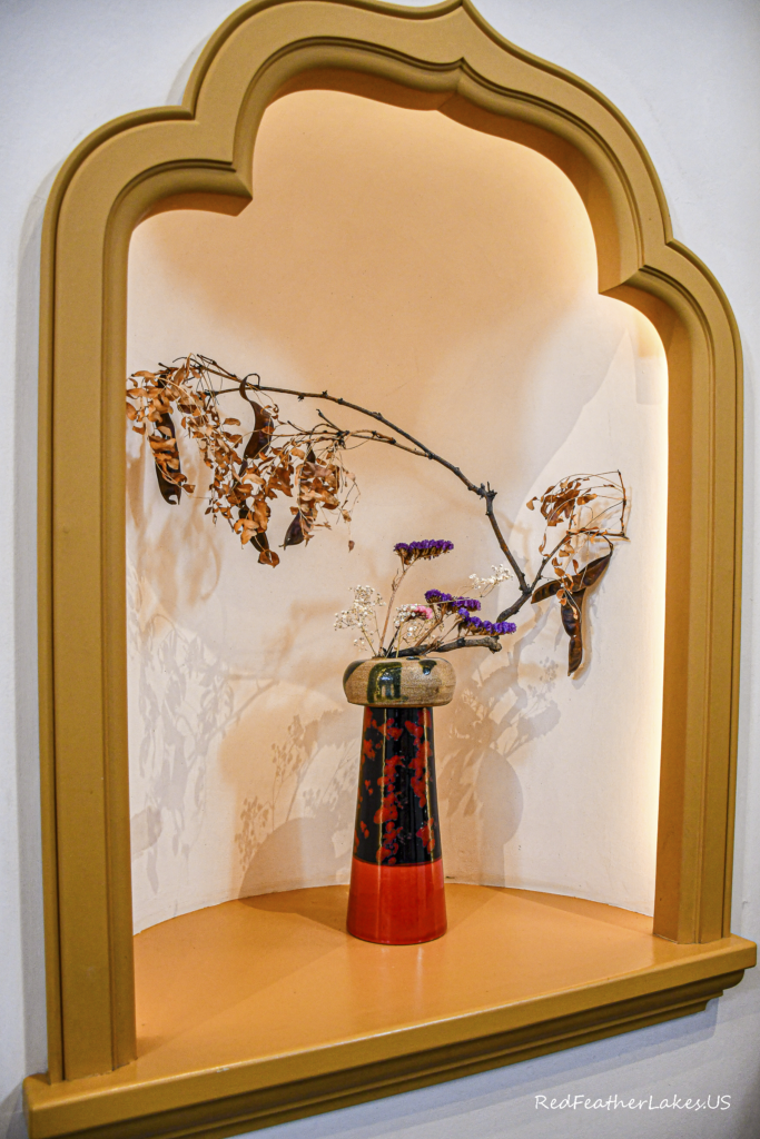 Decorative vase with dried branches and flowers