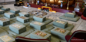 Meditation cushions in serene Buddhist temple setting. Inside the Great Stupa at Drala Mountain Center, Red Feather Lakes Colorado