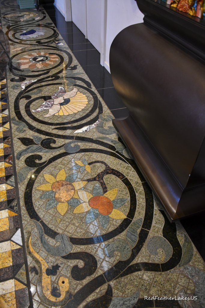 Intricate decorative floor mosaic with colorful patterns.