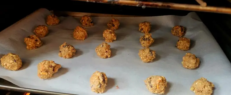 correctly sized cookie dough balls on baking sheet in oven.