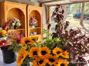 Florist workspace with vibrant flower arrangements