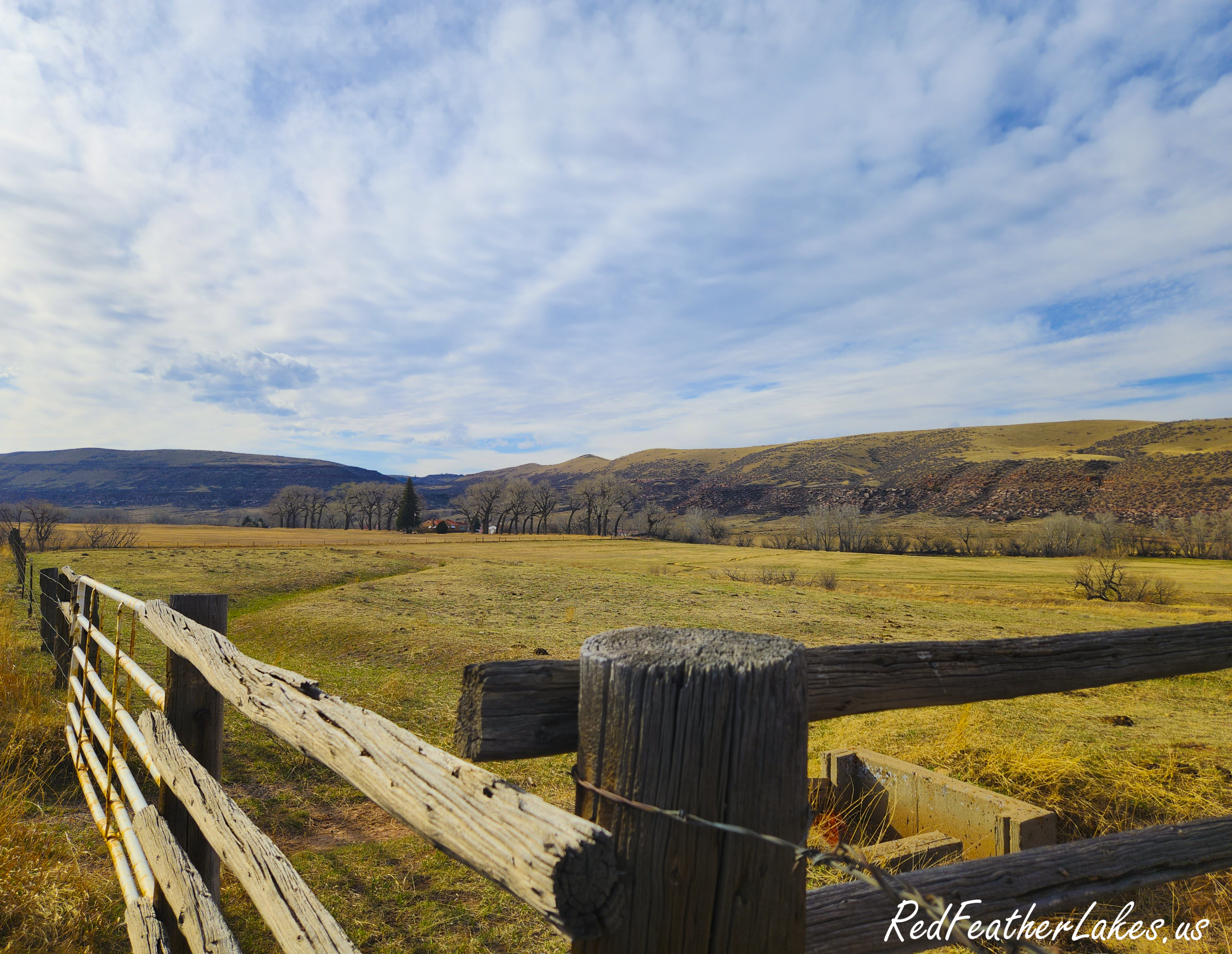 Scenic view of a rural landscape with fence