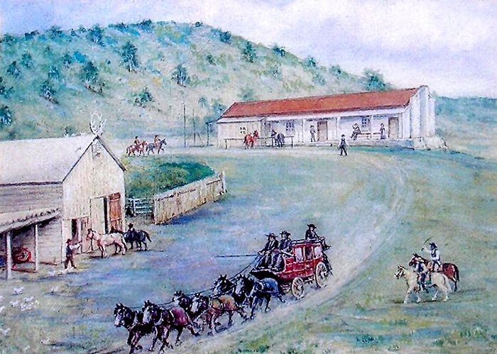 Stagecoach arriving at a rural station