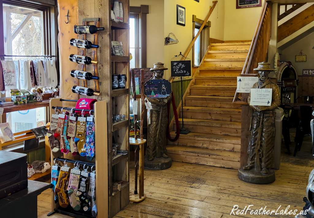 Rustic store interior with wooden staircase at the historic Forks Mercantile and Saloon in Livermore, Colorado