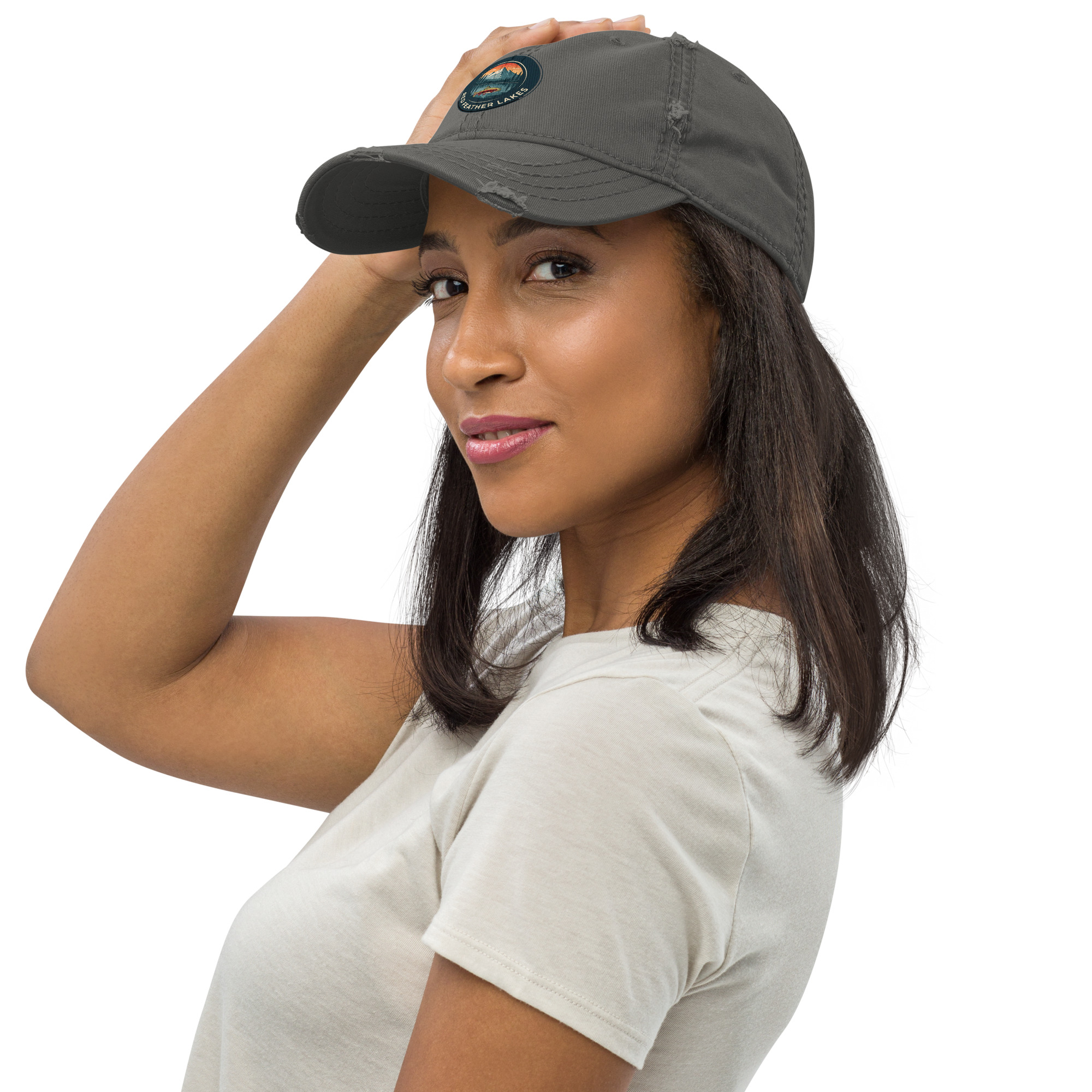 Woman wearing gray baseball cap and light t-shirt