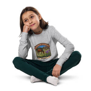 Girl sitting cross-legged in graphic sweatshirt