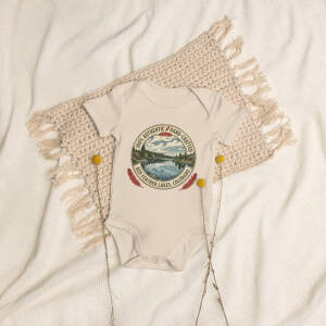 Beige baby onesie with Colorado lake graphic