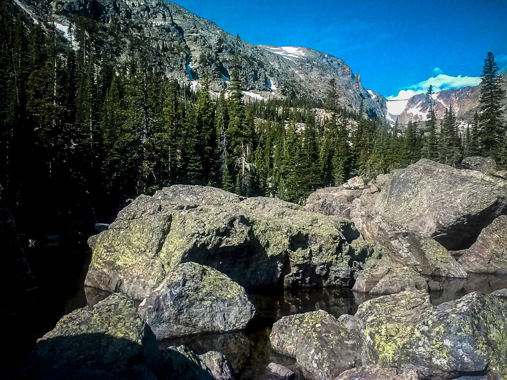 A stretch of the Bear Lake to Nymph Lake trail winding between conifers and rock, Rocky Mountain National Park