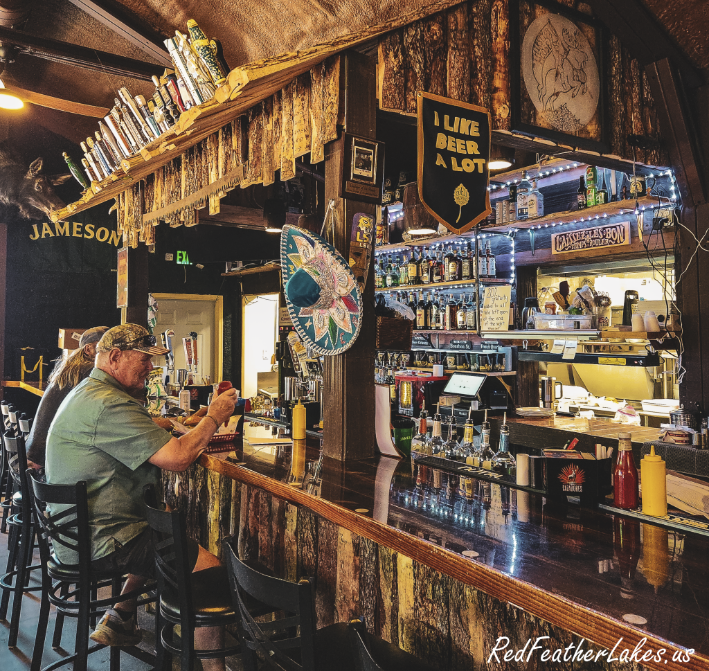 Having a cold brew at the bar inside The Thirsty Moose near Red Feather Lakes, Colorado