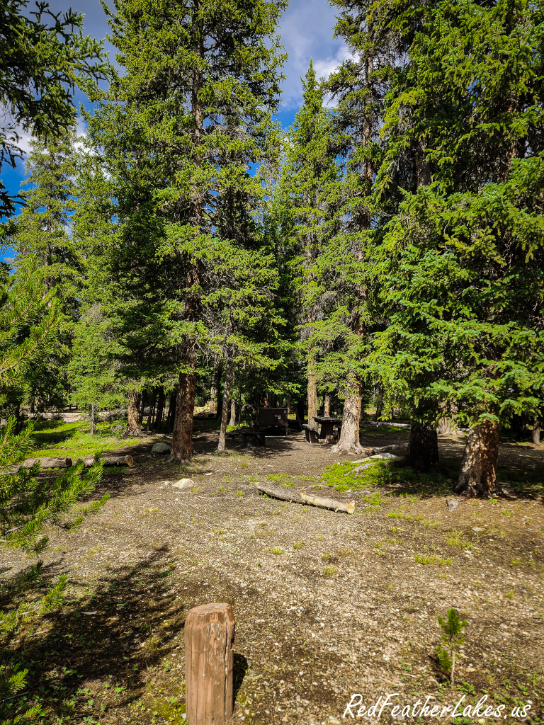 A shaded campsite at Long Draw Campground, the closest place to stay for sunrise and sunset at the reservoir