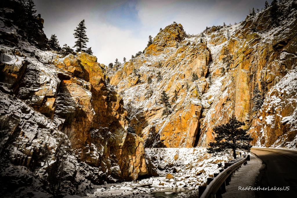 Snow-covered canyon walls above the highway at The Narrows in the Poudre Canyon, Colorado